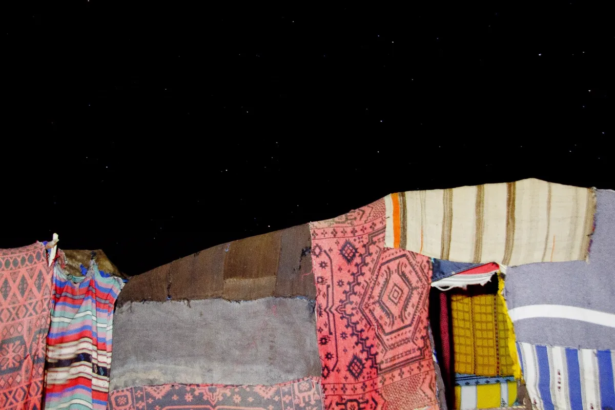 Nomad visit in Merzouga – traditional Berber nomad tent under the Sahara night sky
