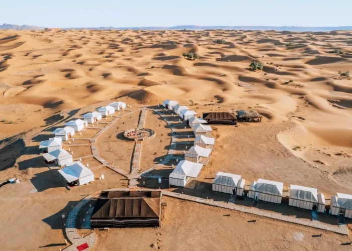 Tents of a Sahara desert camp among the Merzouga dunes