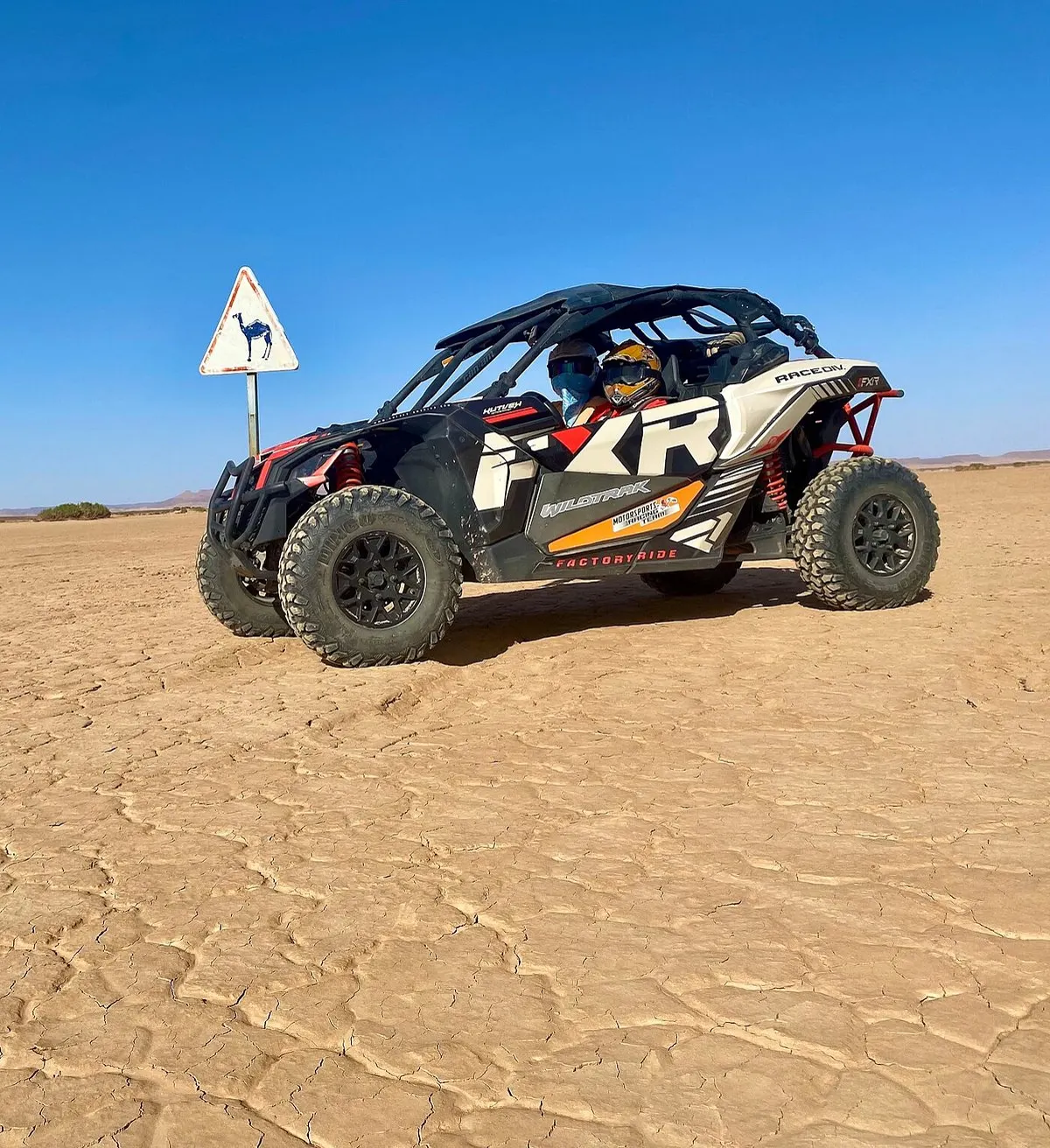 Merzouga buggy tour – two riders in an off-road buggy on desert terrain