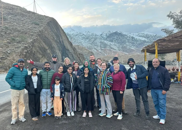 Group photo in the Atlas Mountains during the Marrakech to Fes Sahara tour